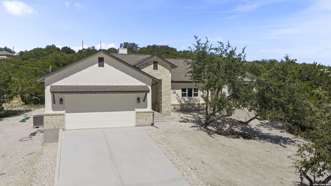 Front exterior of a new home in , Canyon Lake, TX, highlighting curb appeal (Image 2). Front exterior of a new home in , Canyon Lake, TX, highlighting curb appeal (Image 2).