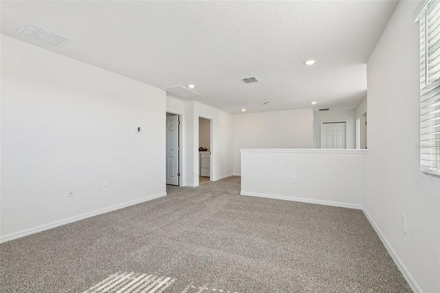 Spacious, unfurnished interior of a new home in Lake Deer Estates - Signature Series, Poinciana (Image 37).