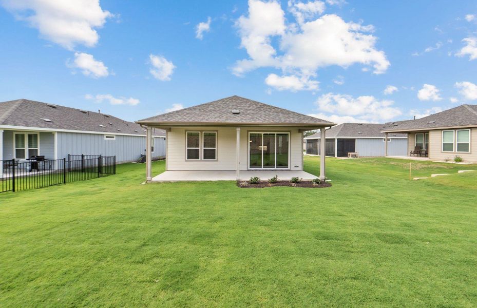 Front exterior of a new home in Sun City Texas, Georgetown, TX, highlighting curb appeal (Image 21).