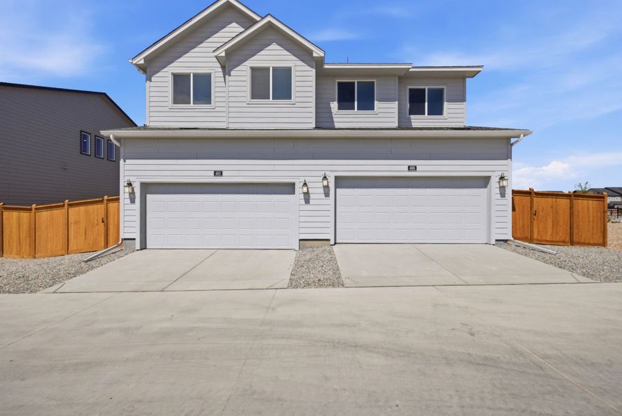 Front exterior of a new home in Sky Ranch, Watkins, CO, highlighting curb appeal (Image 21).