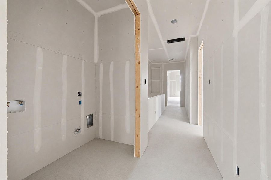 Centrally located laundry room offers convenient access from all bedrooms. Centrally located laundry room offers convenient access from all bedrooms.