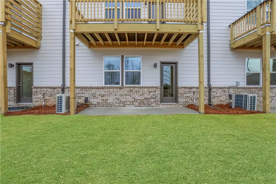 Exterior details and patio area of a home in Towne Village at Suwanee Dam, Sugar Hill (Image 3). Exterior details and patio area of a home in Towne Village at Suwanee Dam, Sugar Hill (Image 3).
