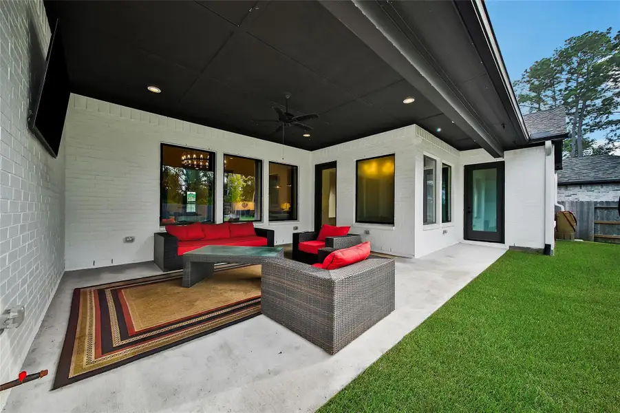 Exterior details and patio area of a home in ARTAVIA, Conroe (Image 22).