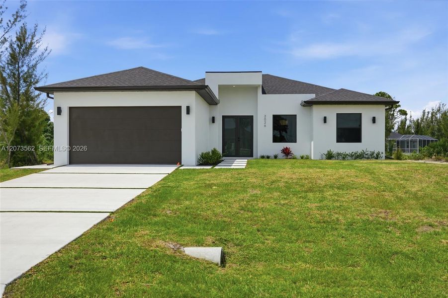 Front exterior of a new home in , Cape Coral, FL, highlighting curb appeal (Image 2). Front exterior of a new home in , Cape Coral, FL, highlighting curb appeal (Image 2).