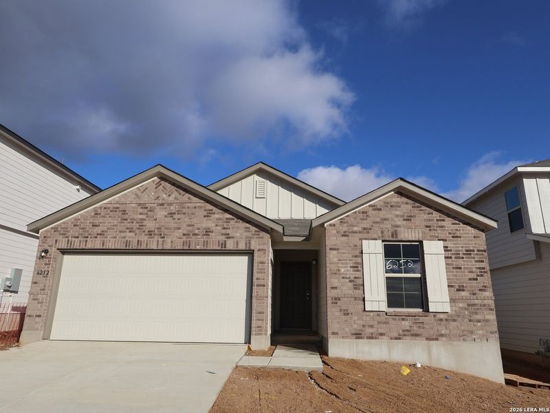 Front exterior of a new home in Mesquite Ridge, San Antonio, TX, highlighting curb appeal (Image 20).
