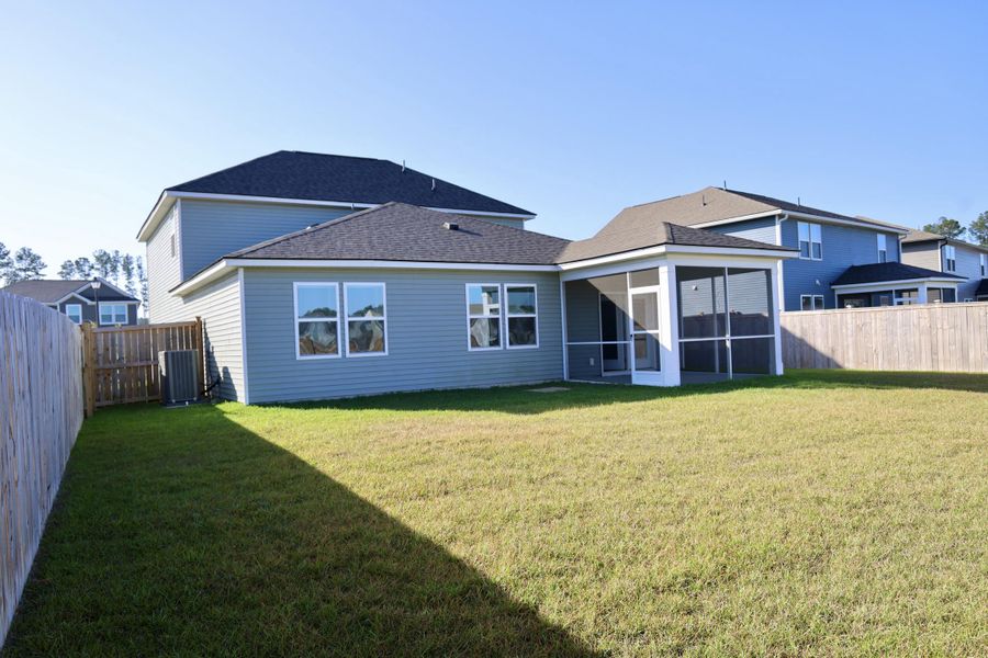 Exterior details and patio area of a home in Sanctuary Cove at Cane Bay, Summerville (Image 24).