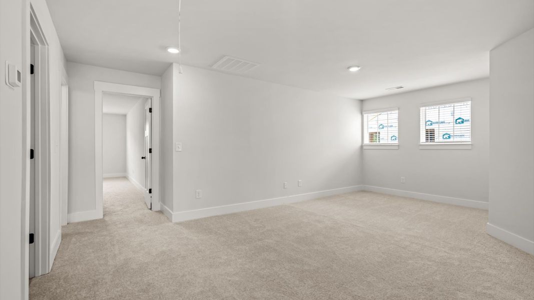 Superior loft space with soft carpet, ideal for work, relaxation, or entertainment