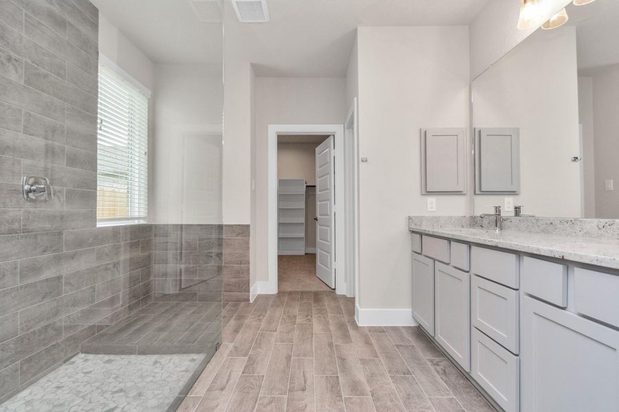Escape to a spa-like oasis in this primary bathroom. Sample photo of completed home with similar floor plan. Actual colors and selections may vary. Escape to a spa-like oasis in this primary bathroom. Sample photo of completed home with similar floor plan. Actual colors and selections may vary.