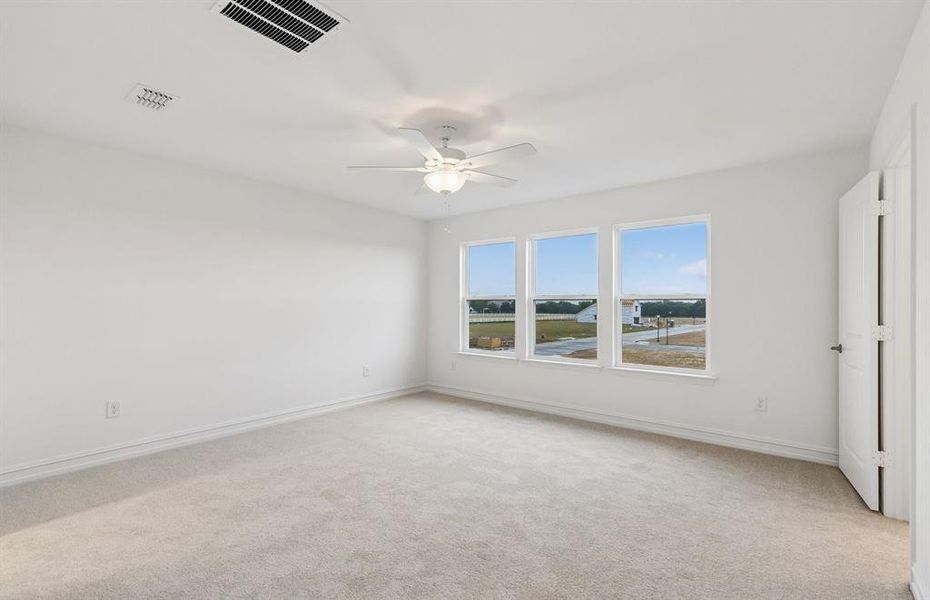 Primary suite with large windows