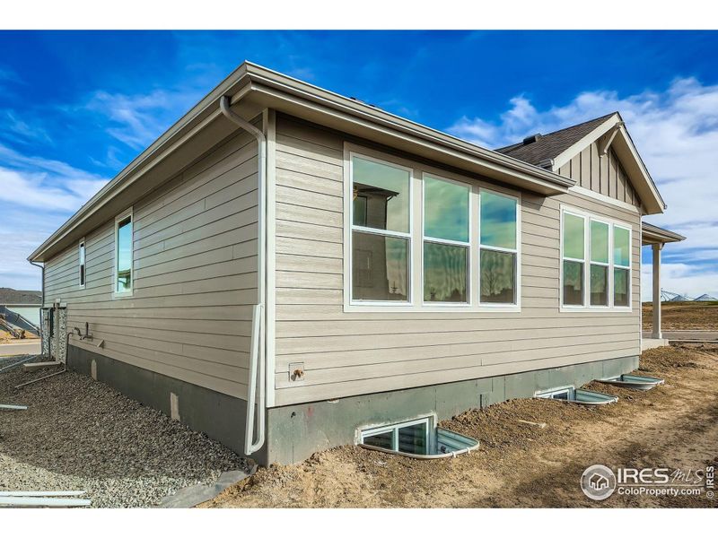 Exterior details and patio area of a home in RainDance National 60/70, Windsor (Image 1).