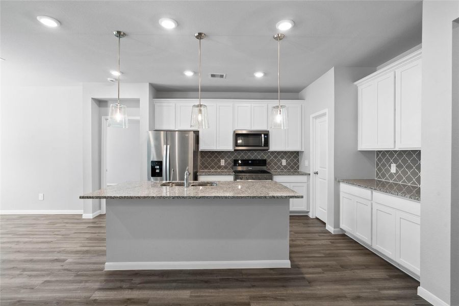 This spacious kitchen and dining combination keeps everyone connected while offering a large center island, abundant cabinetry, and a bright breakfast nook for seamless everyday living and entertaining. This spacious kitchen and dining combination keeps everyone connected while offering a large center island, abundant cabinetry, and a bright breakfast nook for seamless everyday living and entertaining.