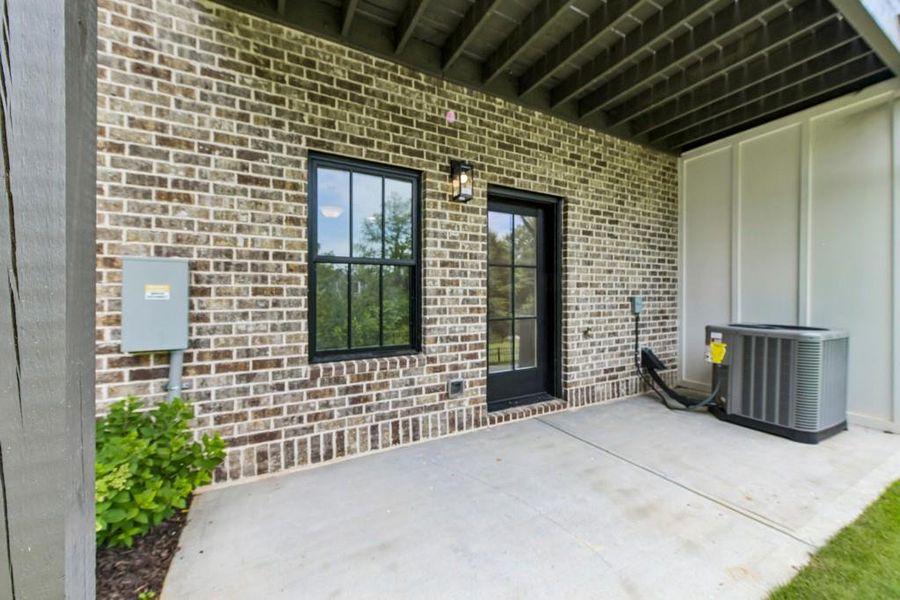 Exterior details and patio area of a home in Skyview On Broad, Sugar Hill (Image 26).