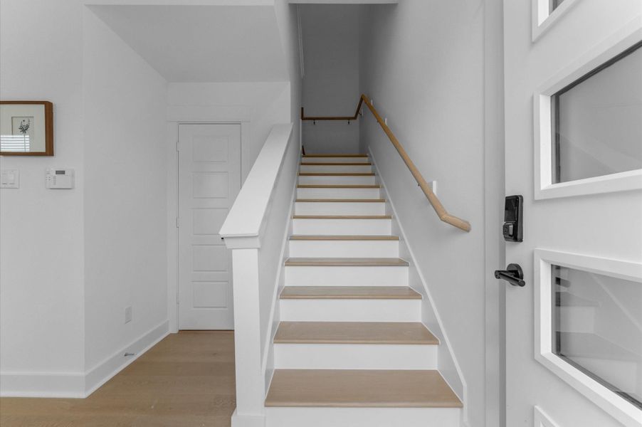 Elegant staircase serves as a stylish transition from the first to the second floor, combining architectural charm with functional design. Elegant staircase serves as a stylish transition from the first to the second floor, combining architectural charm with functional design.