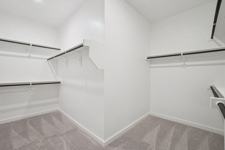 A white room with a staircase.