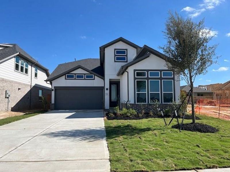 The Armstrong plan by Newmark Homes is a stunning design that appears to be a single-story from the front but reveals a spacious two-story layout inside. This beautiful home features high ceilings, creating an open and airy atmosphere throughout. With 4 bedrooms, 3 full bathrooms, a study, game room, and media room, it perfectly blends style and functionality for modern living.