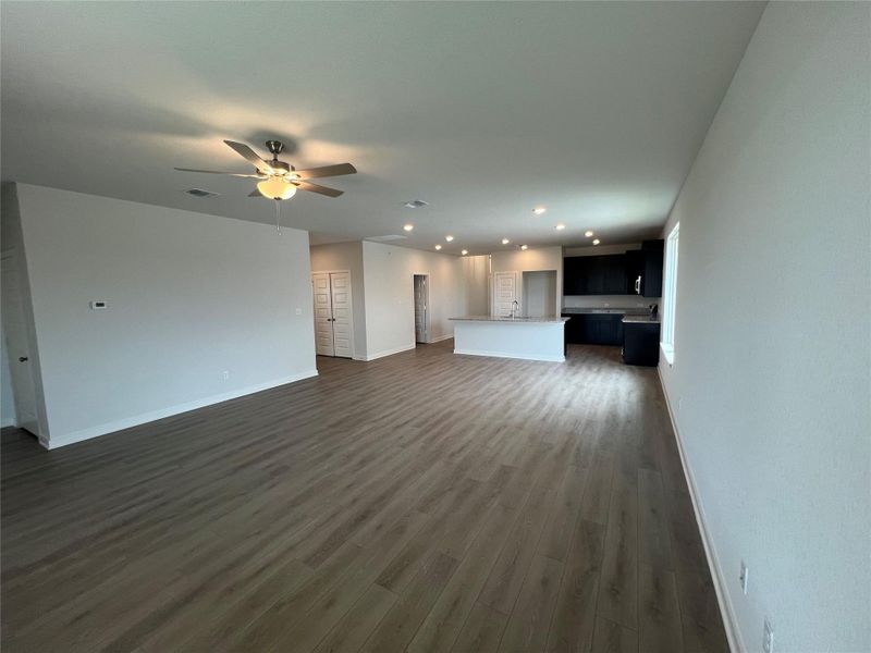 An open floorplan seamlessly connects the living area to the contemporary kitchen.