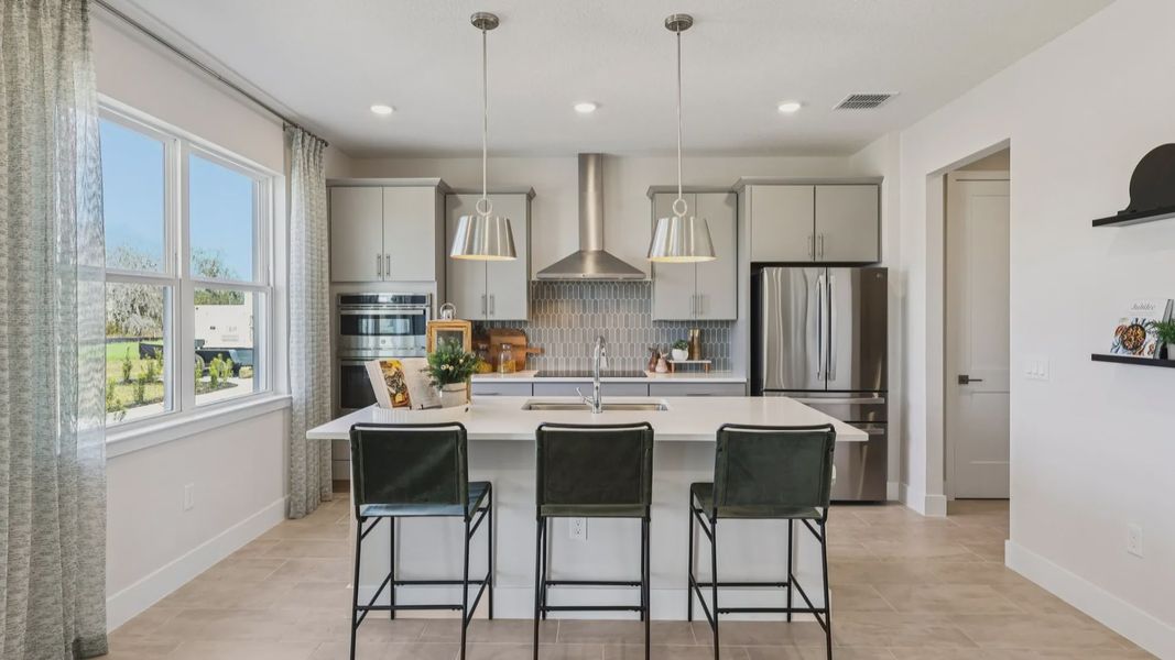 The Mangrove Kitchen at Lakeside at Satilla by DRB Homes in Saint Cloud, FL The Mangrove Kitchen at Lakeside at Satilla by DRB Homes in Saint Cloud, FL