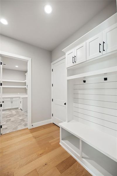 Mudroom featuring light wood-type flooring