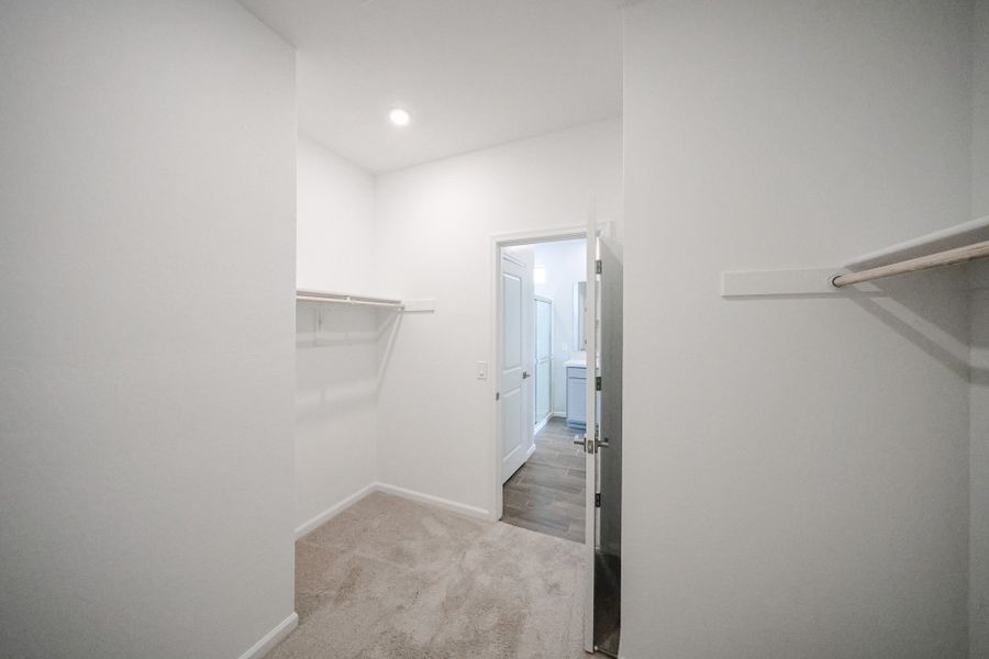 A hallway with white walls.