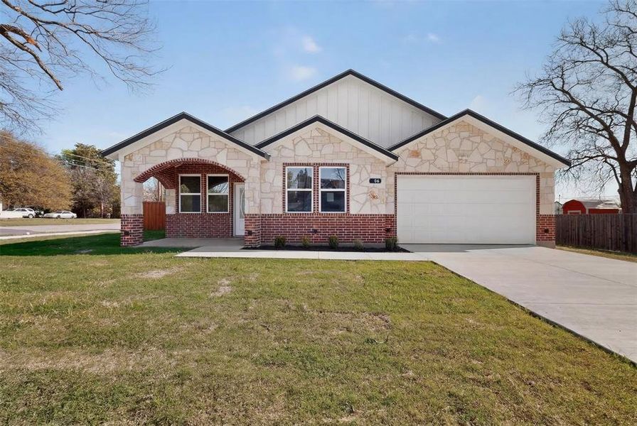 Front exterior of a new home in , Terrell, TX, highlighting curb appeal (Image 19). Front exterior of a new home in , Terrell, TX, highlighting curb appeal (Image 19).