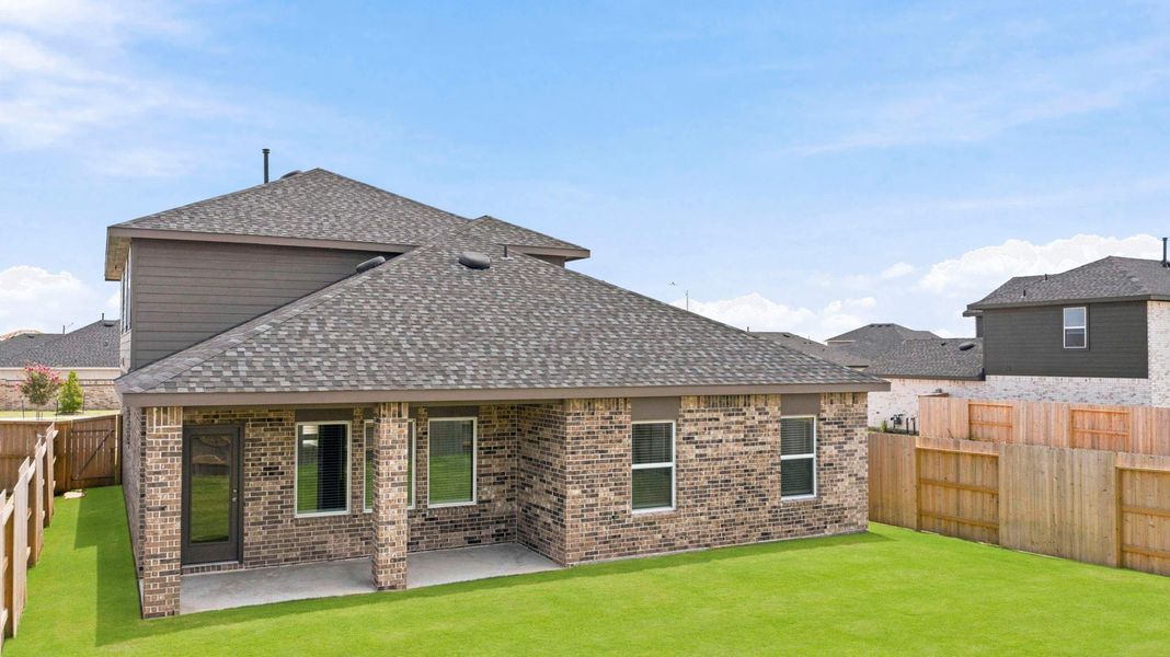 Exterior details and patio area of a home in Sunterra Lakes, Brookshire (Image 23).
