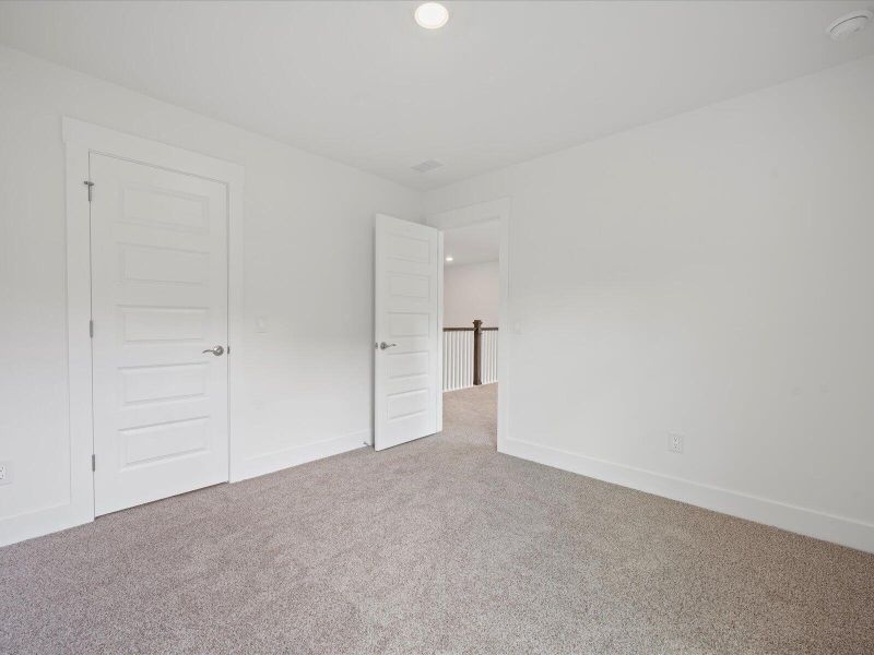 Spacious, unfurnished interior of a new home in The Coves at Lakes of Cane Bay, Summerville (Image 32). Spacious, unfurnished interior of a new home in The Coves at Lakes of Cane Bay, Summerville (Image 32).