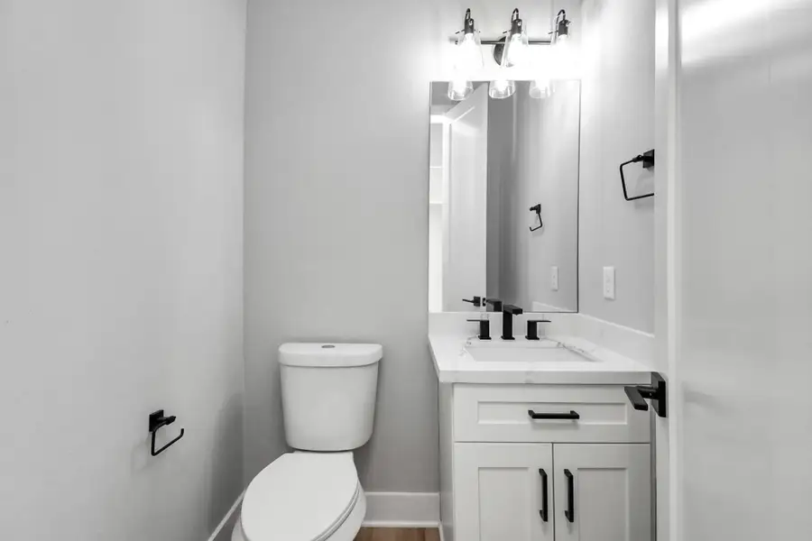 Stylish half bathroom with modern fixtures and clean finishes. Sleek design offers both functionality and convenience.
