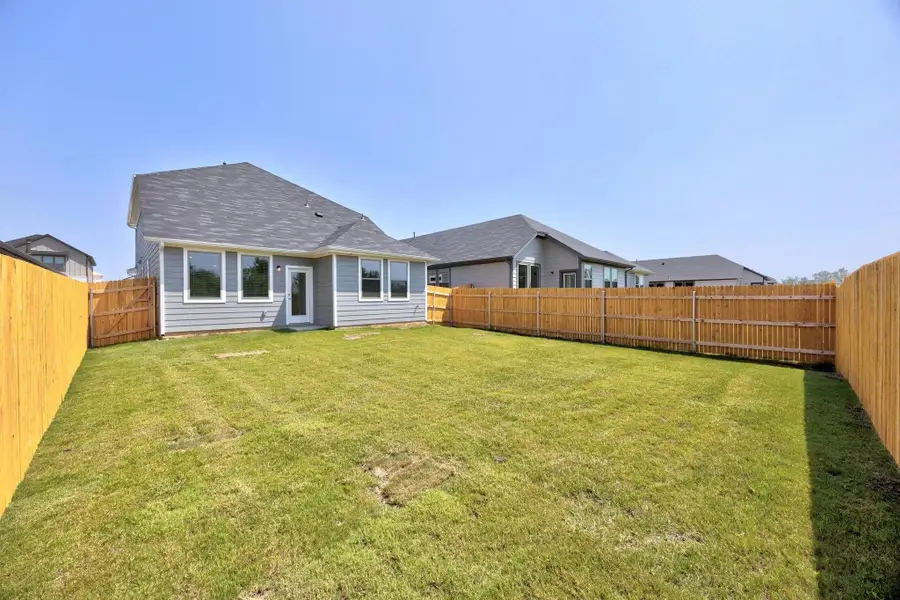 Exterior details and patio area of a home in Trinity Ranch, Elgin (Image 2).