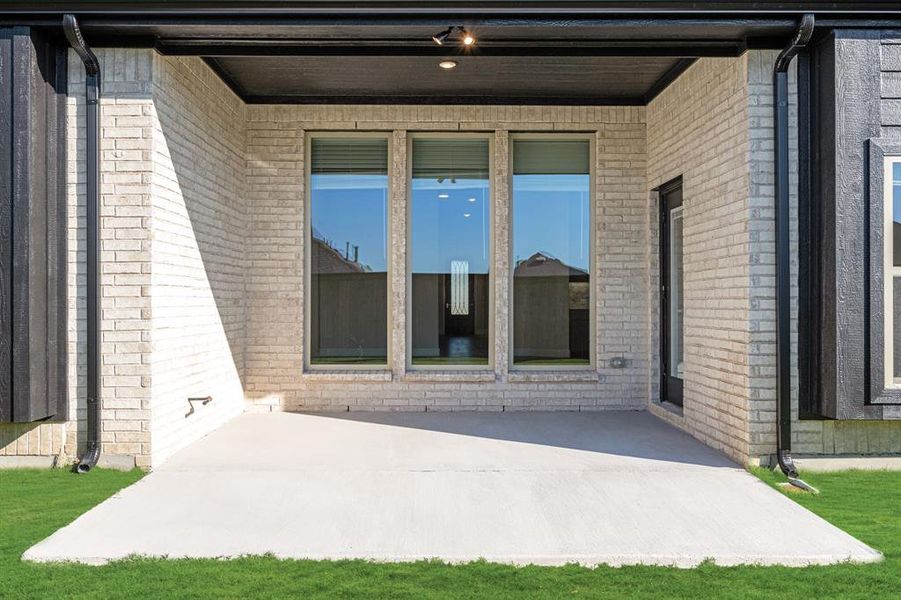 Exterior details and patio area of a home in ArrowBrooke Classic 50, Aubrey (Image 25).