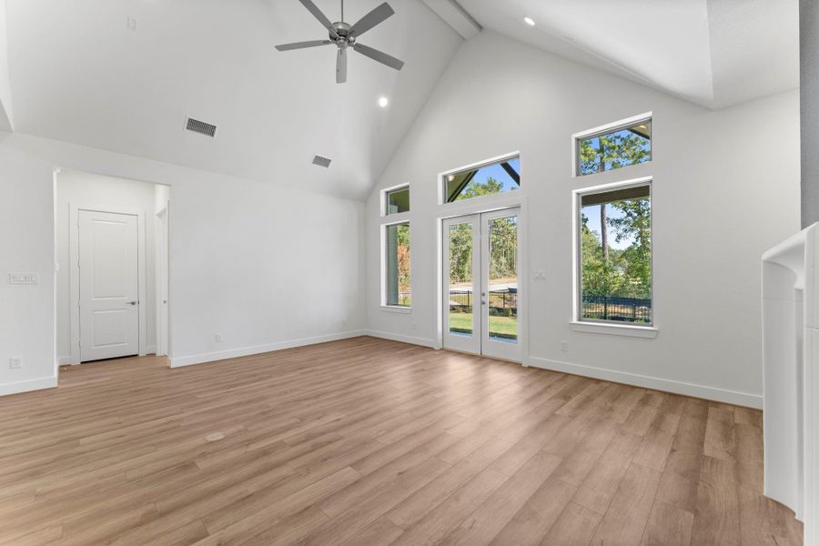 The bright and airy great room includes a wall of windows with a view of the private backyard. The bright and airy great room includes a wall of windows with a view of the private backyard.