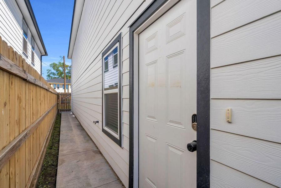Unit A is mirror reversed. This is the Private entrance for Unit B where you can see each side of the property is completely fenced with easy access down a tidy concrete path which guide you home. The double keypad on Front Door makes it super easy for you to program code for you or Airbnb Guests. Unit A is mirror reversed. This is the Private entrance for Unit B where you can see each side of the property is completely fenced with easy access down a tidy concrete path which guide you home. The double keypad on Front Door makes it super easy for you to program code for you or Airbnb Guests.