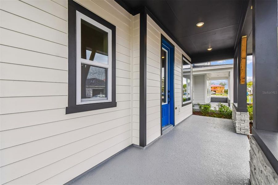 Exterior details and patio area of a home in Weslyn Park in Sunbridge 34', St. Cloud (Image 26).