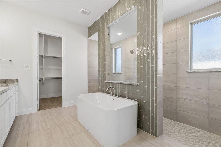 Our Justin plan features our signature bath with walk through shower and free standing tub! Our Justin plan features our signature bath with walk through shower and free standing tub!