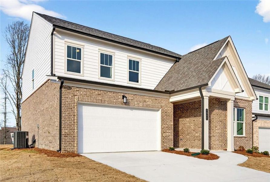 Front exterior of a new home in , Lawrenceville, GA, highlighting curb appeal (Image 2). Front exterior of a new home in , Lawrenceville, GA, highlighting curb appeal (Image 2).