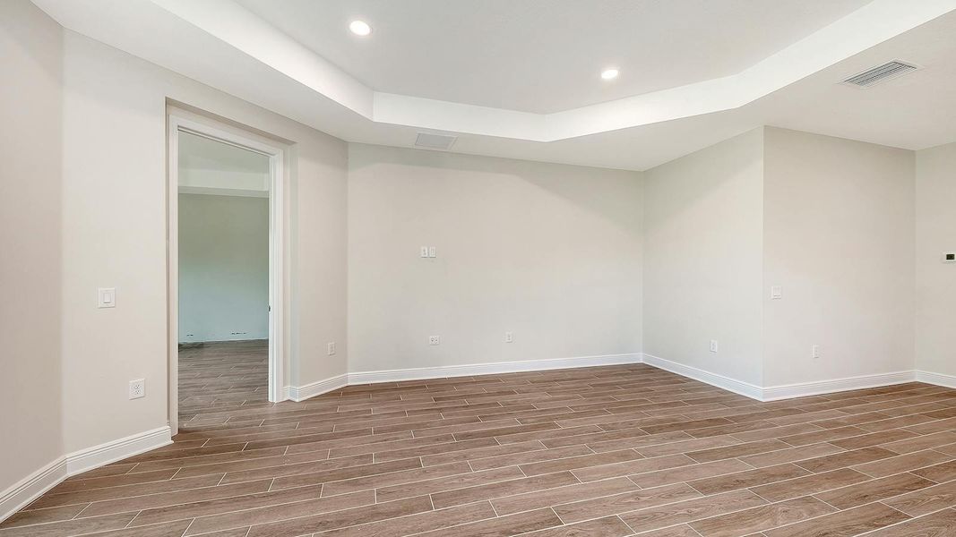 Spacious, unfurnished interior of a new home in Grand Park Real Estate and Homes for Sale in Sarasota, FL - Neal Communities, Sarasota (Image 34).