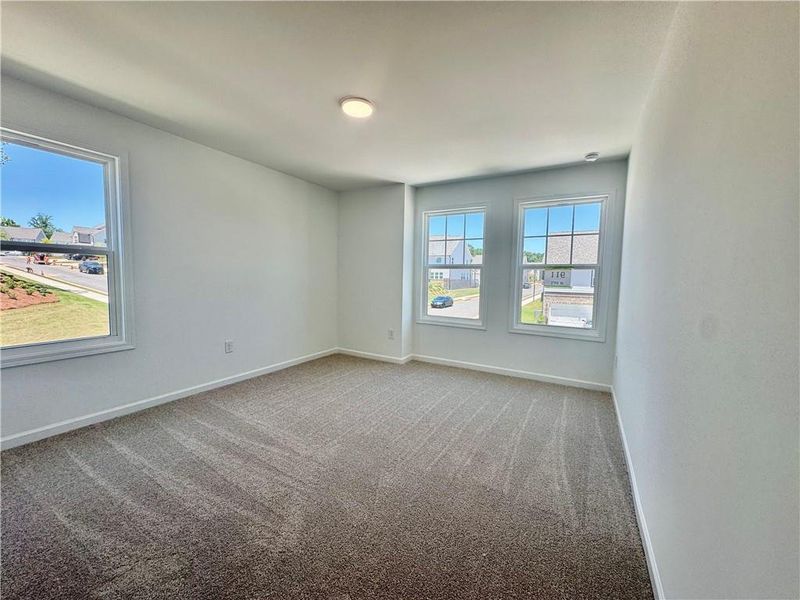 Spacious, unfurnished interior of a new home in Eastlyn Crossing, Flowery Branch (Image 25).
