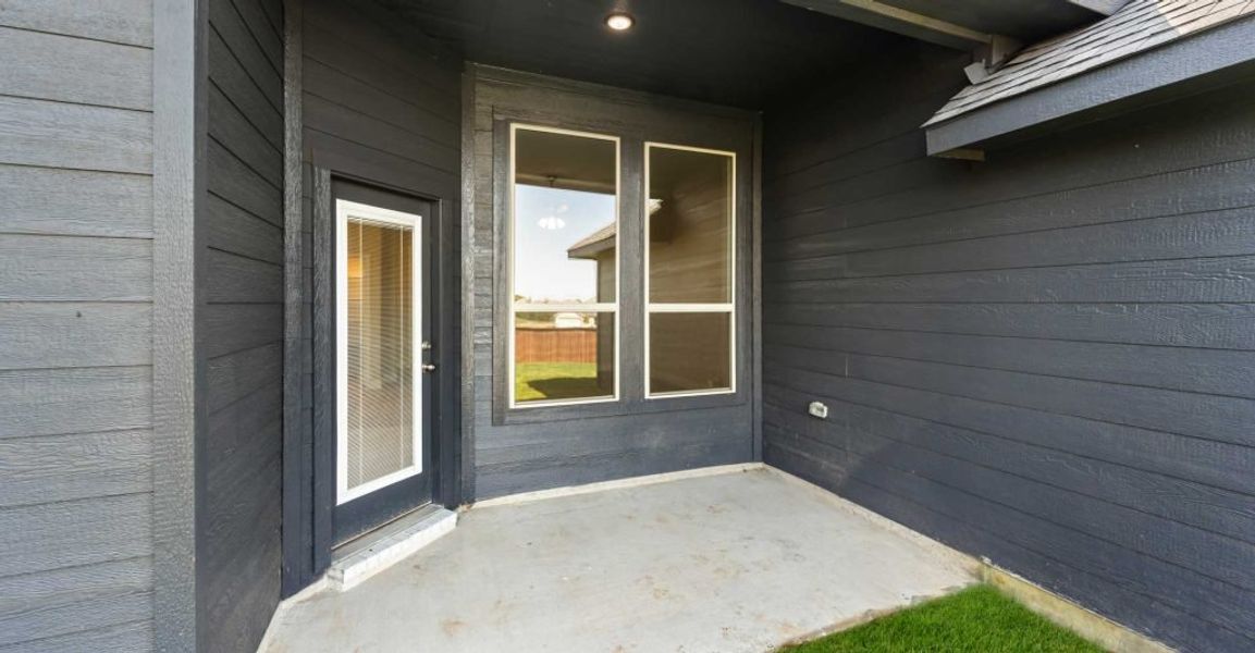 Representative exterior photo of a completed home built from the Alderbury by Impression Homes in Timberbrook, Justin, TX (Image 26).