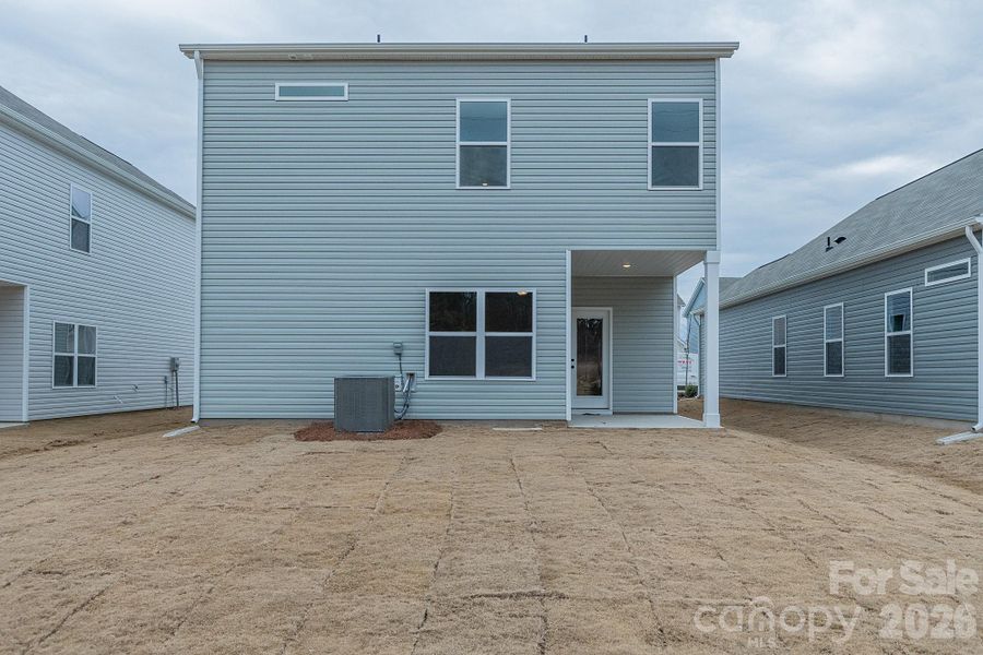 Exterior details and patio area of a home in Country Club Village, Salisbury (Image 3).