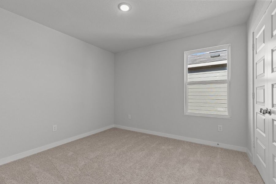 A room with a door and a window.