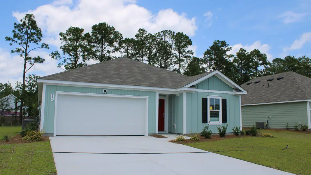 Front exterior of a new home in Carrington Woods, Longs, SC, highlighting curb appeal (Image 2). Front exterior of a new home in Carrington Woods, Longs, SC, highlighting curb appeal (Image 2).