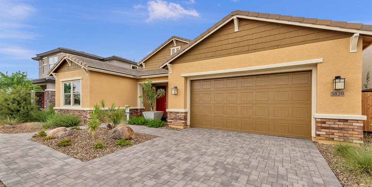 Front exterior of a new home in Legends at Thunderbird, Glendale, AZ, highlighting curb appeal (Image 24). Front exterior of a new home in Legends at Thunderbird, Glendale, AZ, highlighting curb appeal (Image 24).