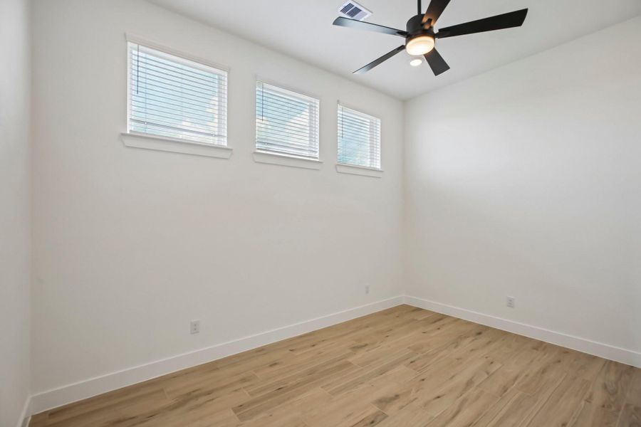 Spacious, unfurnished interior of a new home in Riceland 60',65',70', Old River-Winfree (Image 20).