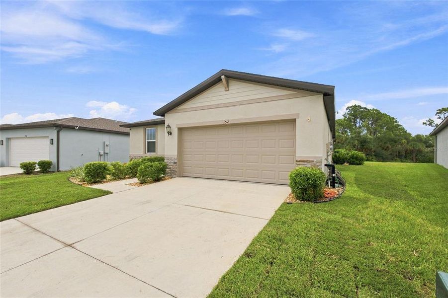 Front exterior of a new home in , Nokomis, FL, highlighting curb appeal (Image 2). Front exterior of a new home in , Nokomis, FL, highlighting curb appeal (Image 2).