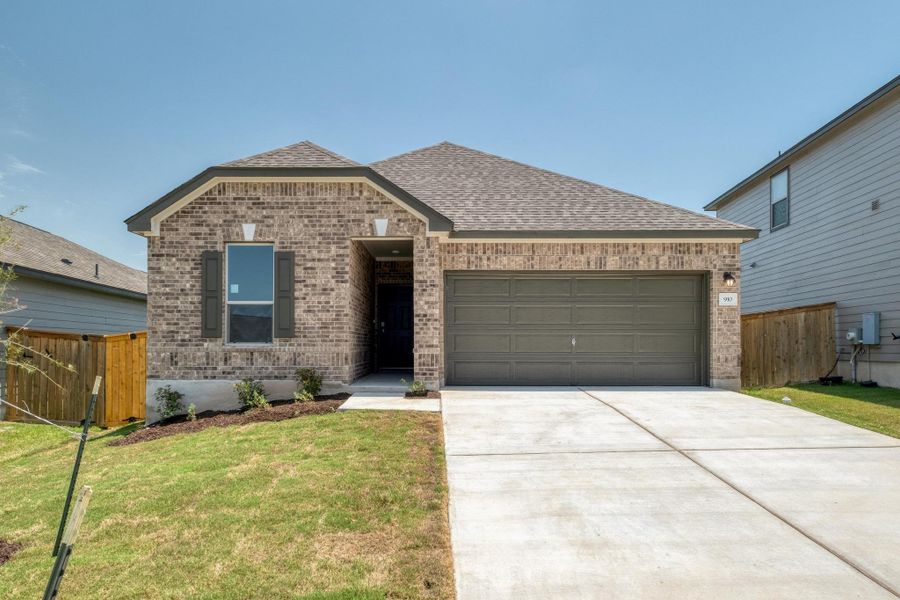 Front exterior of a new home in Sonterra - Cool Water, Jarrell, TX, highlighting curb appeal (Image 1).