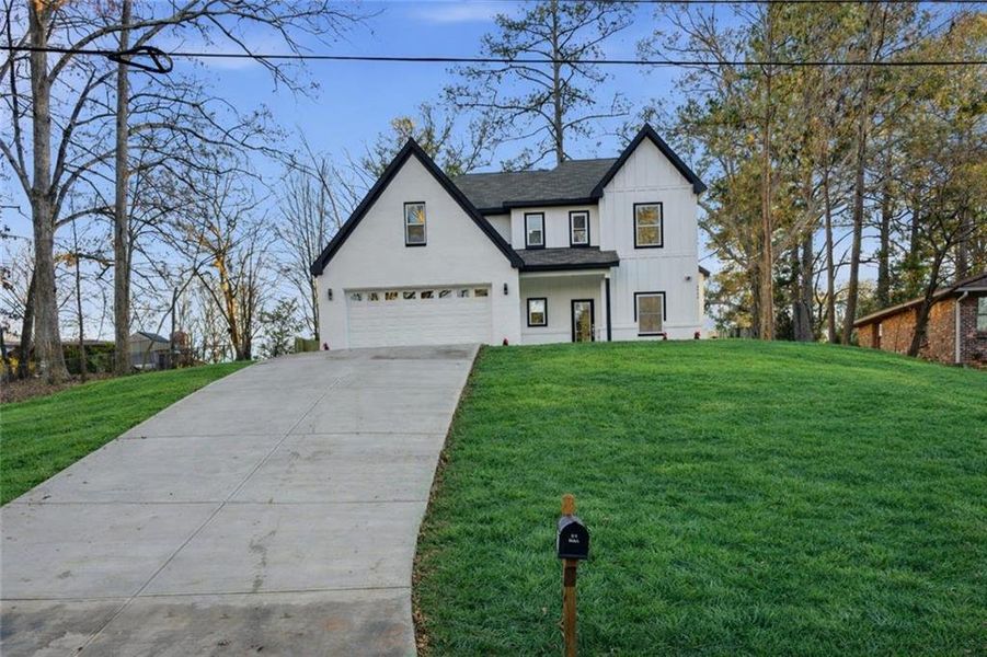 Front exterior of a new home in , Conyers, GA, highlighting curb appeal (Image 26).