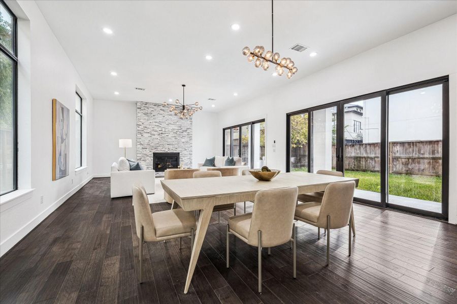 The dining room offers a bright and elegant setting, featuring abundant natural light, graceful proportions, and a seamless connection to the living and kitchen areas.