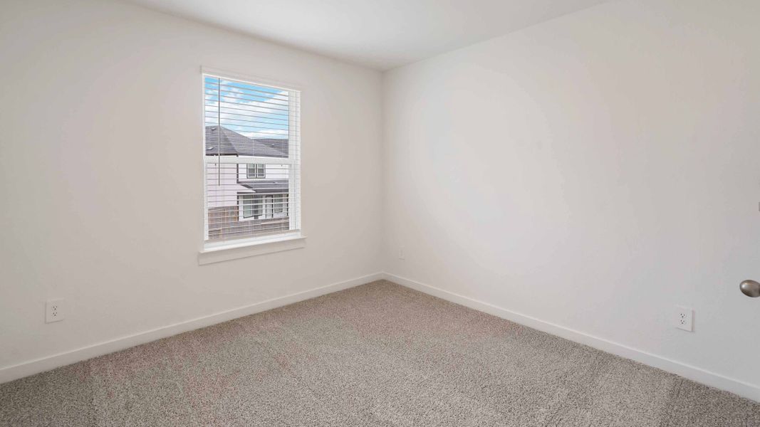 Representative unfurnished interior of a home built from the Iris by D.R. Horton in City Gate North, Houston (Image 12).