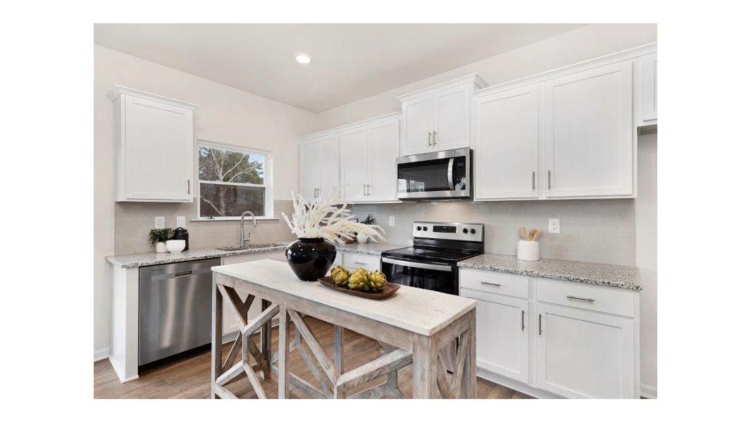 Representative furnished interior of a home built from the Taylor by D.R. Horton in Falls at Hickory, Hickory (Image 8).
