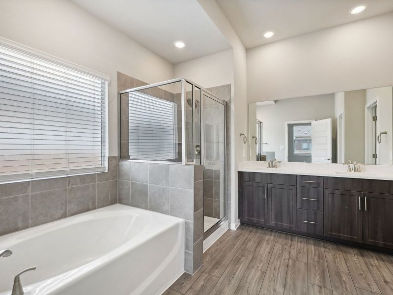 Live in luxury with a stand alone bathtub and walk-in shower in the primary bathroom.