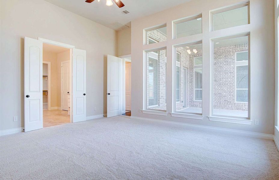 Representative unfurnished interior of a home built from the 3710 by Ravenna Homes in Artavia 70′, Conroe (Image 35).